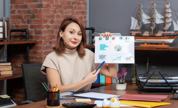 front-view-pretty-woman-showing-diagrams-working-office